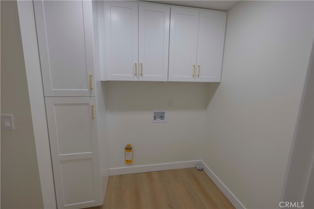 20530 Clark Street Perris, CA 92570 - Photo 17 of 25 a view of storage and utility room with cabinets