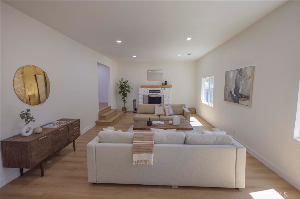 20530 Clark Street Perris, CA 92570 - Photo 2 of 25 a living room with furniture and a mirror