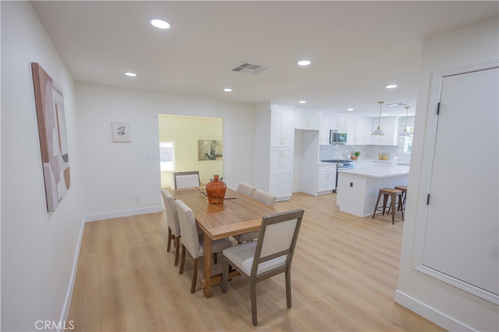 20530 Clark Street Perris, CA 92570 - Photo 6 of 25 a view of a dining room with furniture and wooden floor
