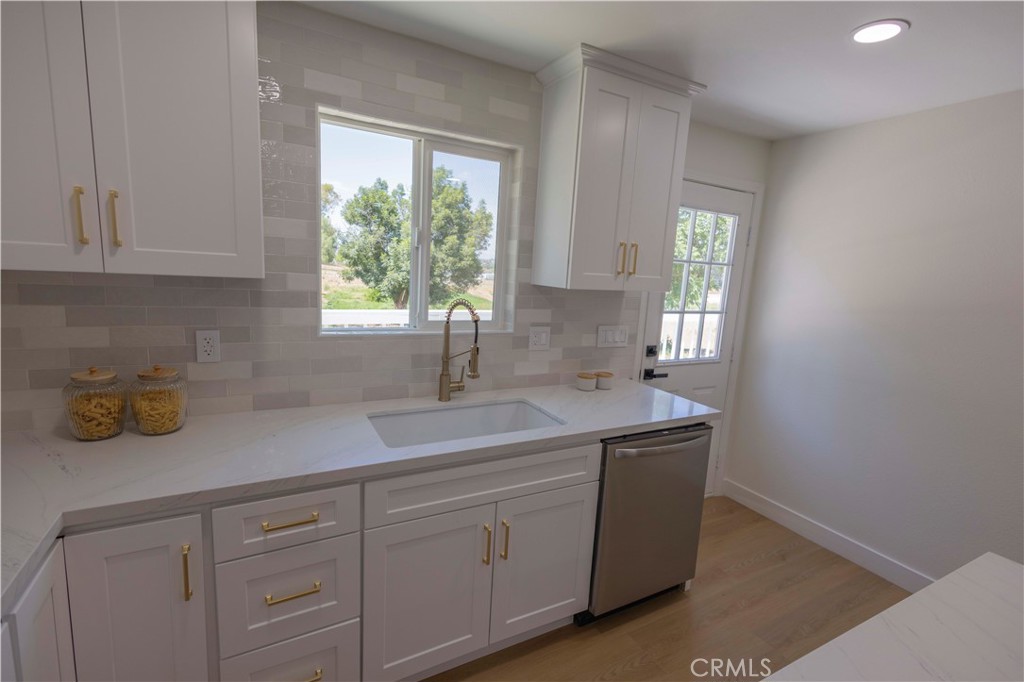 20530 Clark Street Perris, CA 92570 - Photo 8 of 25 a kitchen with a sink and cabinets