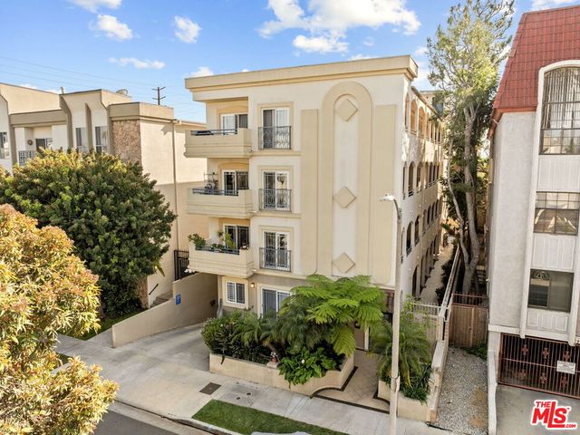 a front view of a residential houses with yard