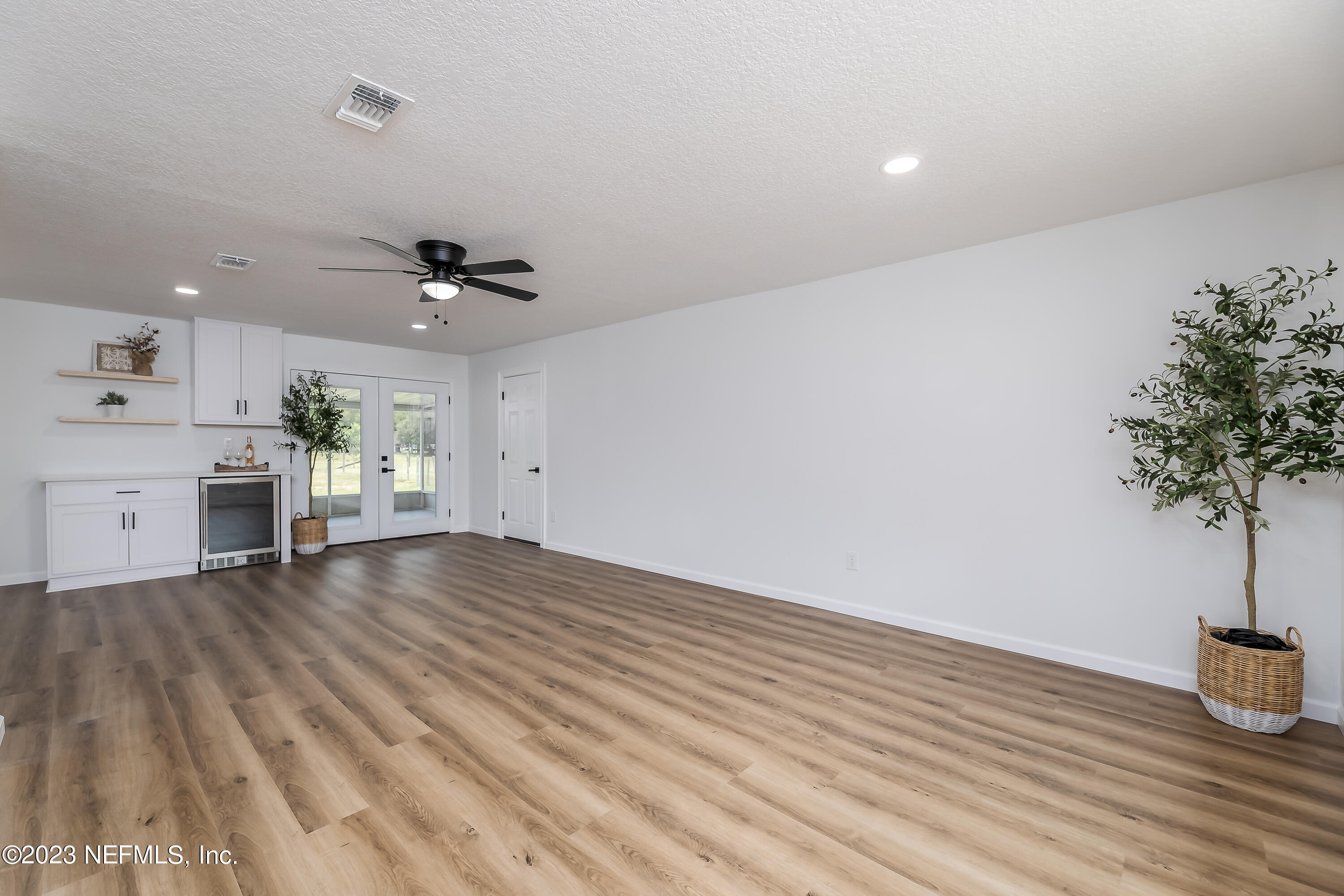 1492 Long Bay Road Middleburg, FL 32068 - Photo 8 of 44 wooden floor in an empty room with a window