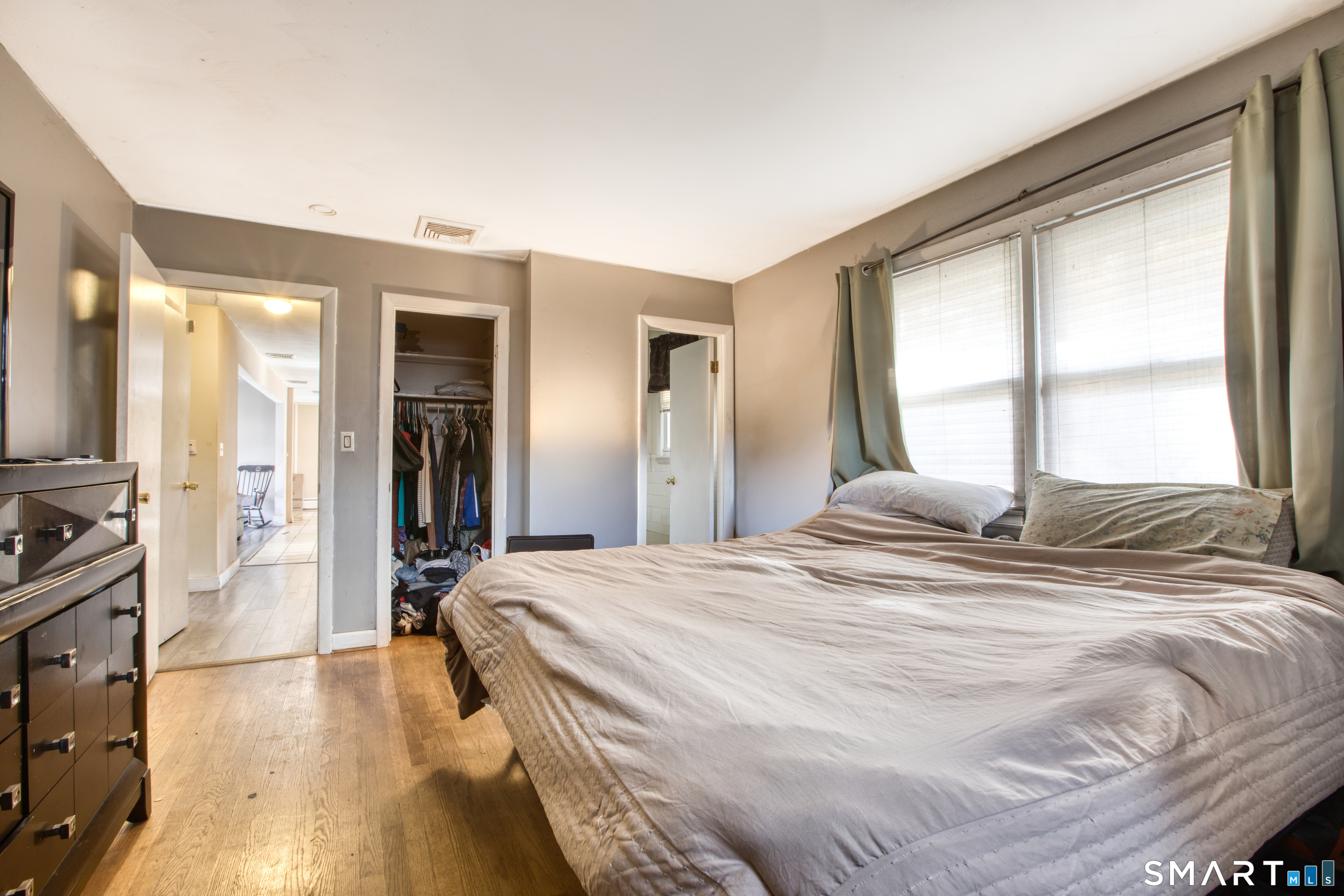 123 Andover Road East Hartford, CT 06108 - Photo 11 of 22 a bedroom with a bed and a large window