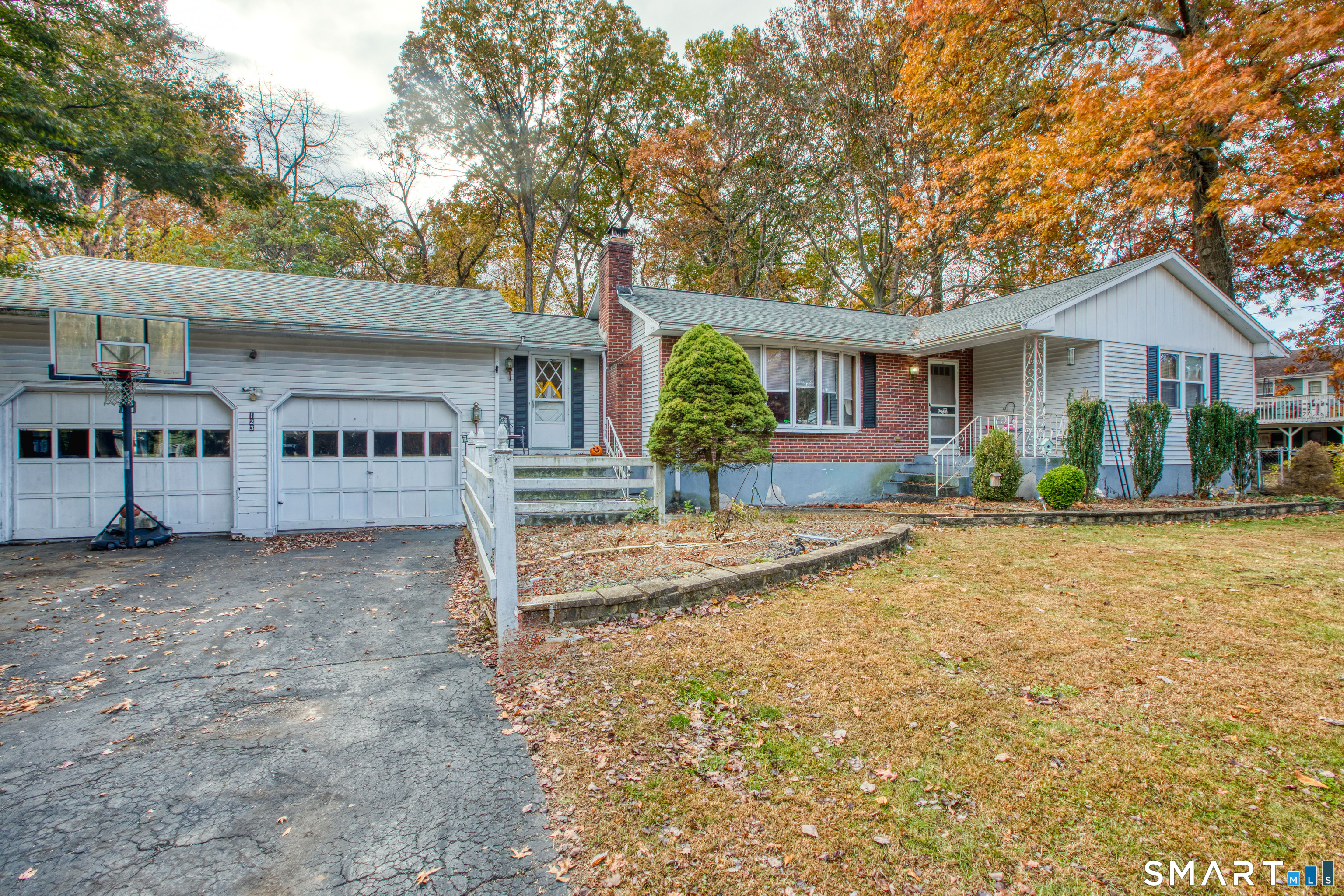 123 Andover Road East Hartford, CT 06108 - Photo 3 of 22 a view of a house with a yard and garage
