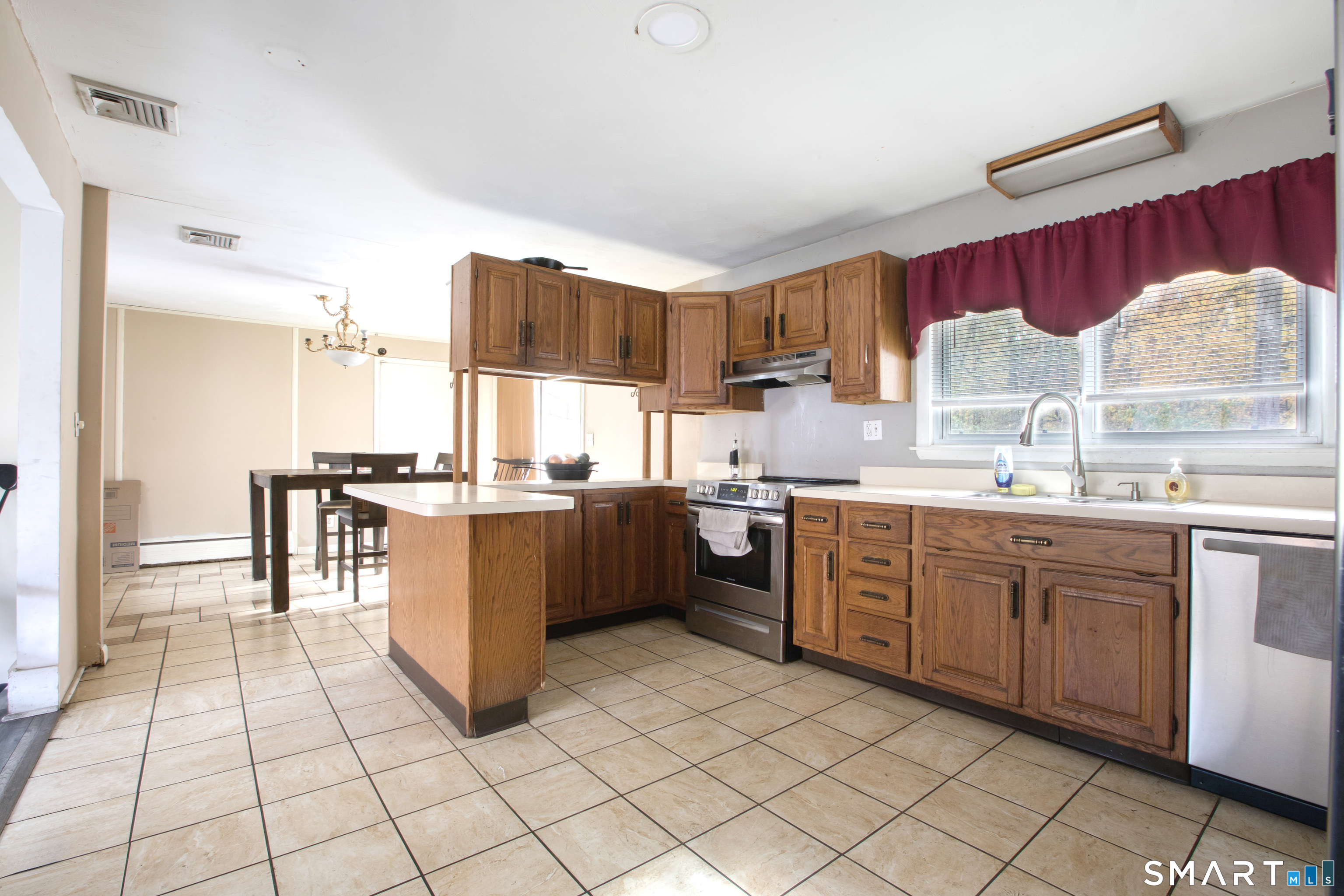 123 Andover Road East Hartford, CT 06108 - Photo 5 of 22 a kitchen with a sink cabinets and appliances