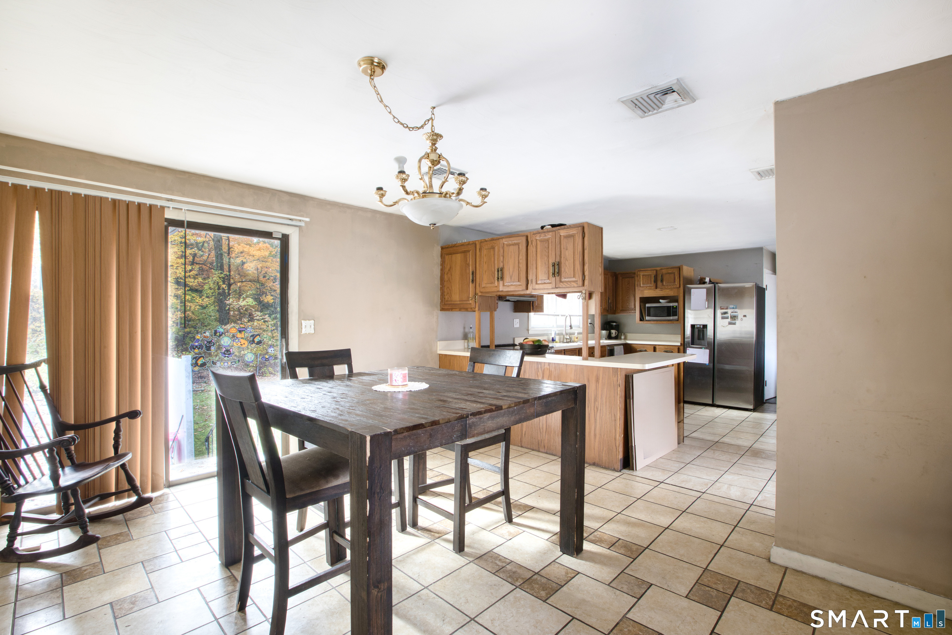 123 Andover Road East Hartford, CT 06108 - Photo 6 of 22 a view of a dining room with furniture window and outside view