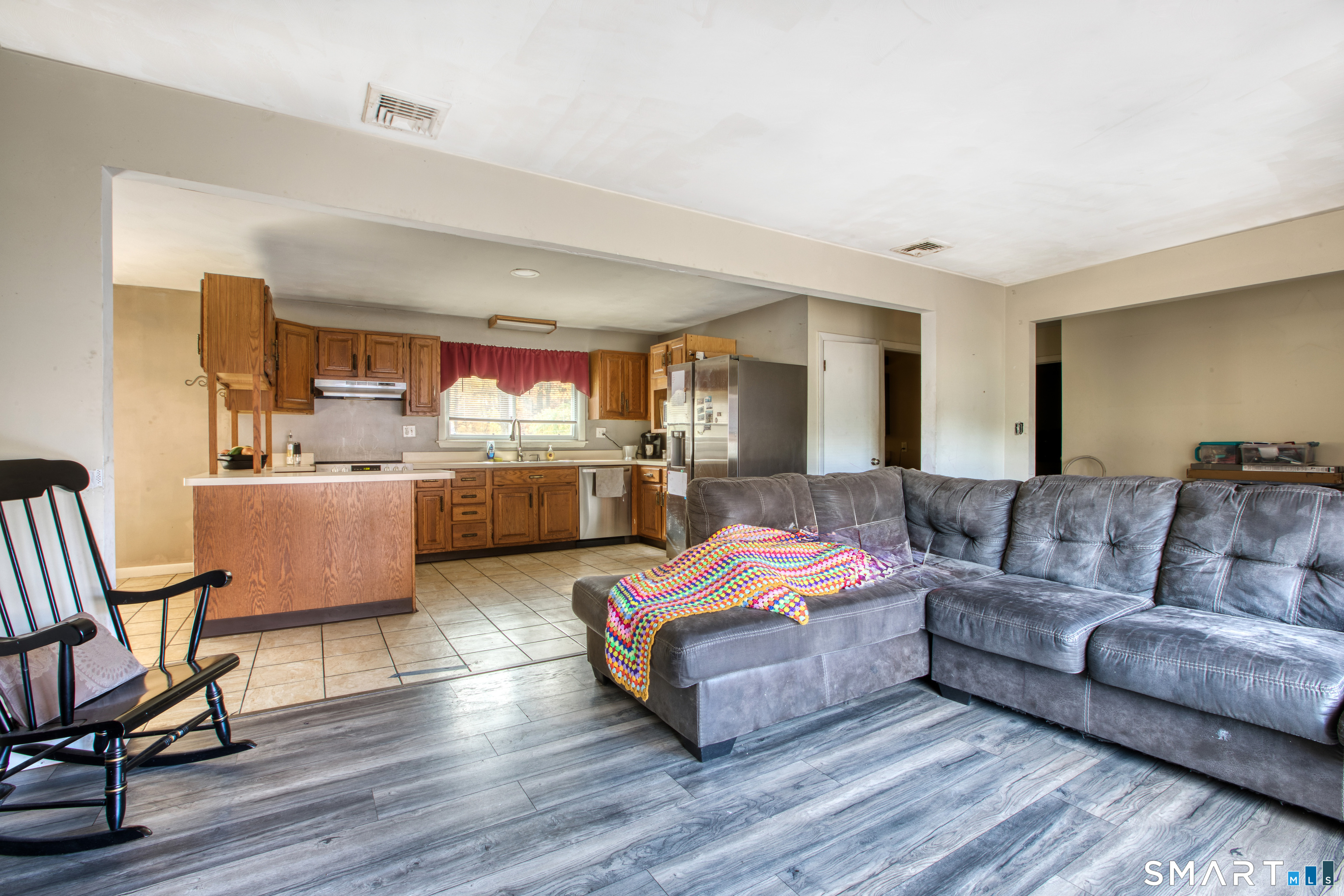 123 Andover Road East Hartford, CT 06108 - Photo 9 of 22 a living room with furniture and a wooden floor