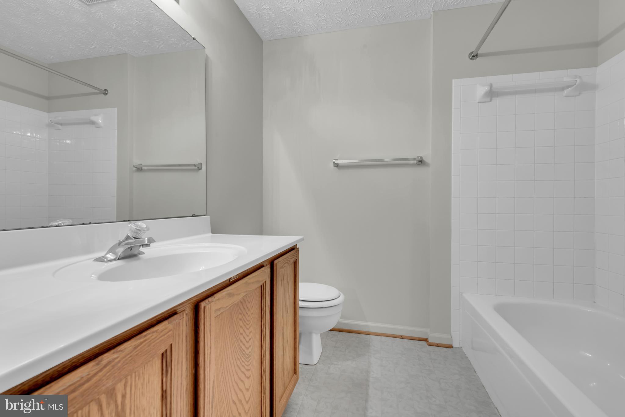 2407 Warm Spring Way Odenton, MD 21113 - Photo 15 of 45 a bathroom with a sink a toilet and shower