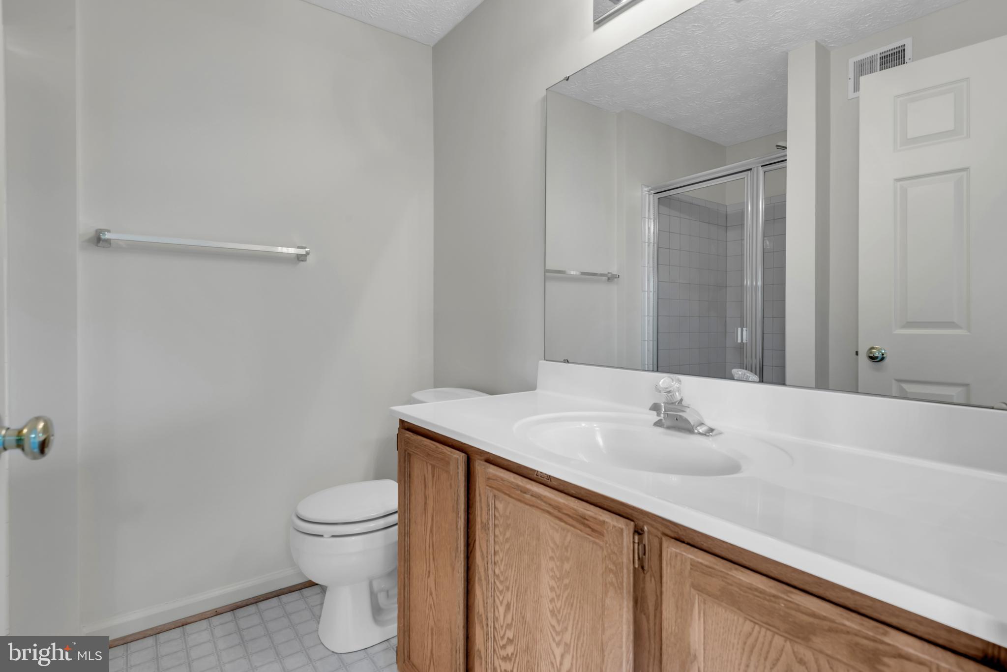 2407 Warm Spring Way Odenton, MD 21113 - Photo 19 of 45 a bathroom with a sink toilet and vanity