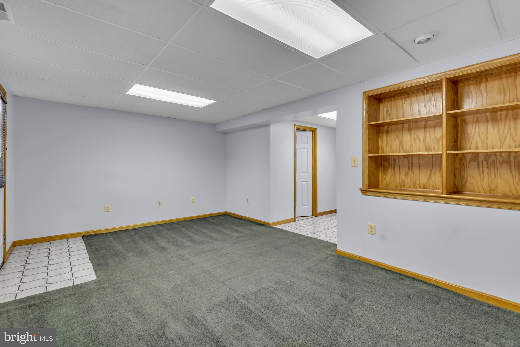 2407 Warm Spring Way Odenton, MD 21113 - Photo 27 of 45 an empty room with cabinet and windows