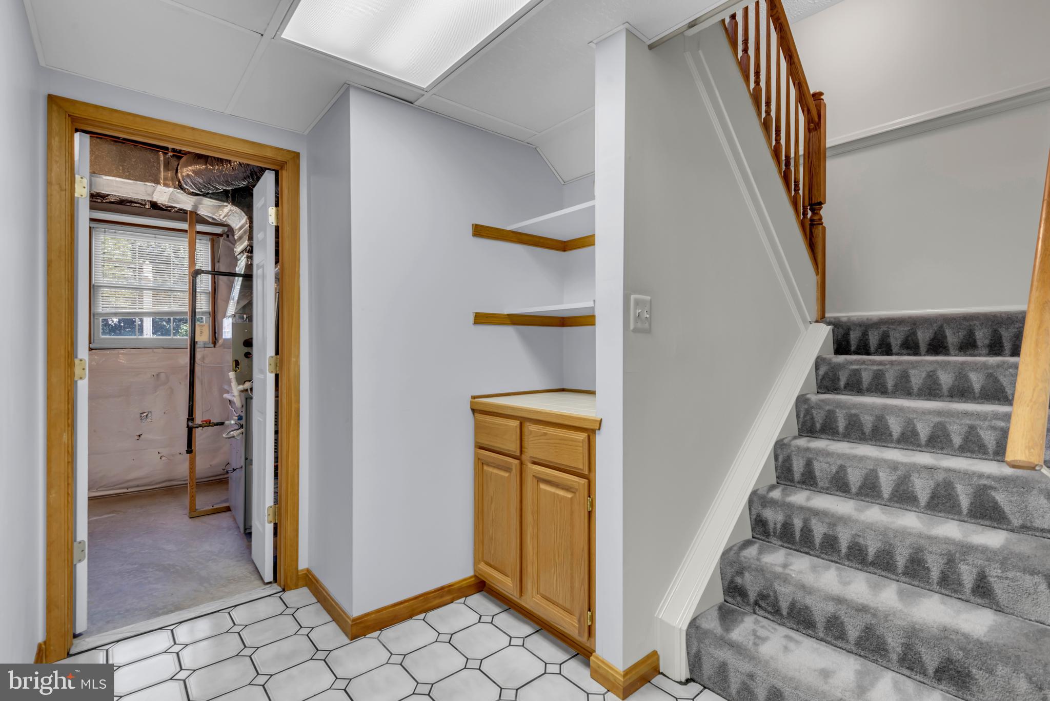 2407 Warm Spring Way Odenton, MD 21113 - Photo 28 of 45 a view of an entryway with wooden floor and a hallway