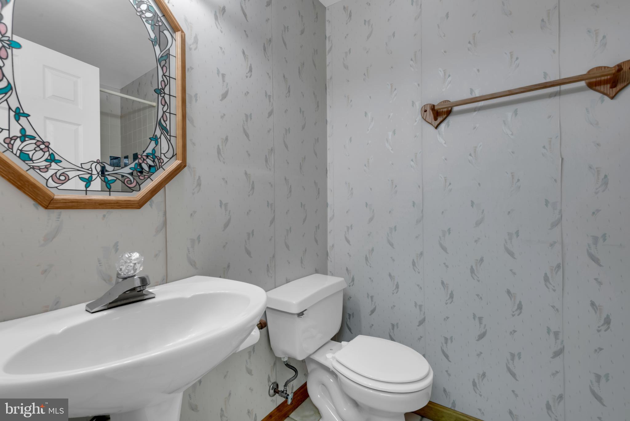 2407 Warm Spring Way Odenton, MD 21113 - Photo 30 of 45 a bathroom with a sink a toilet and shower