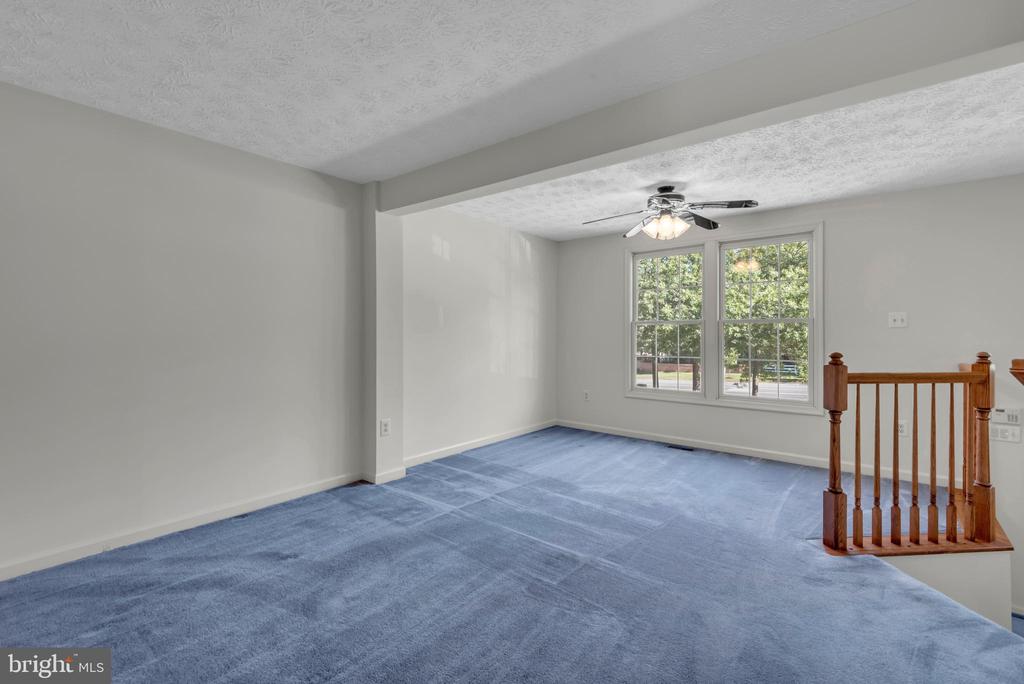 2407 Warm Spring Way Odenton, MD 21113 - Photo 3 of 45 an empty room with windows and chandelier