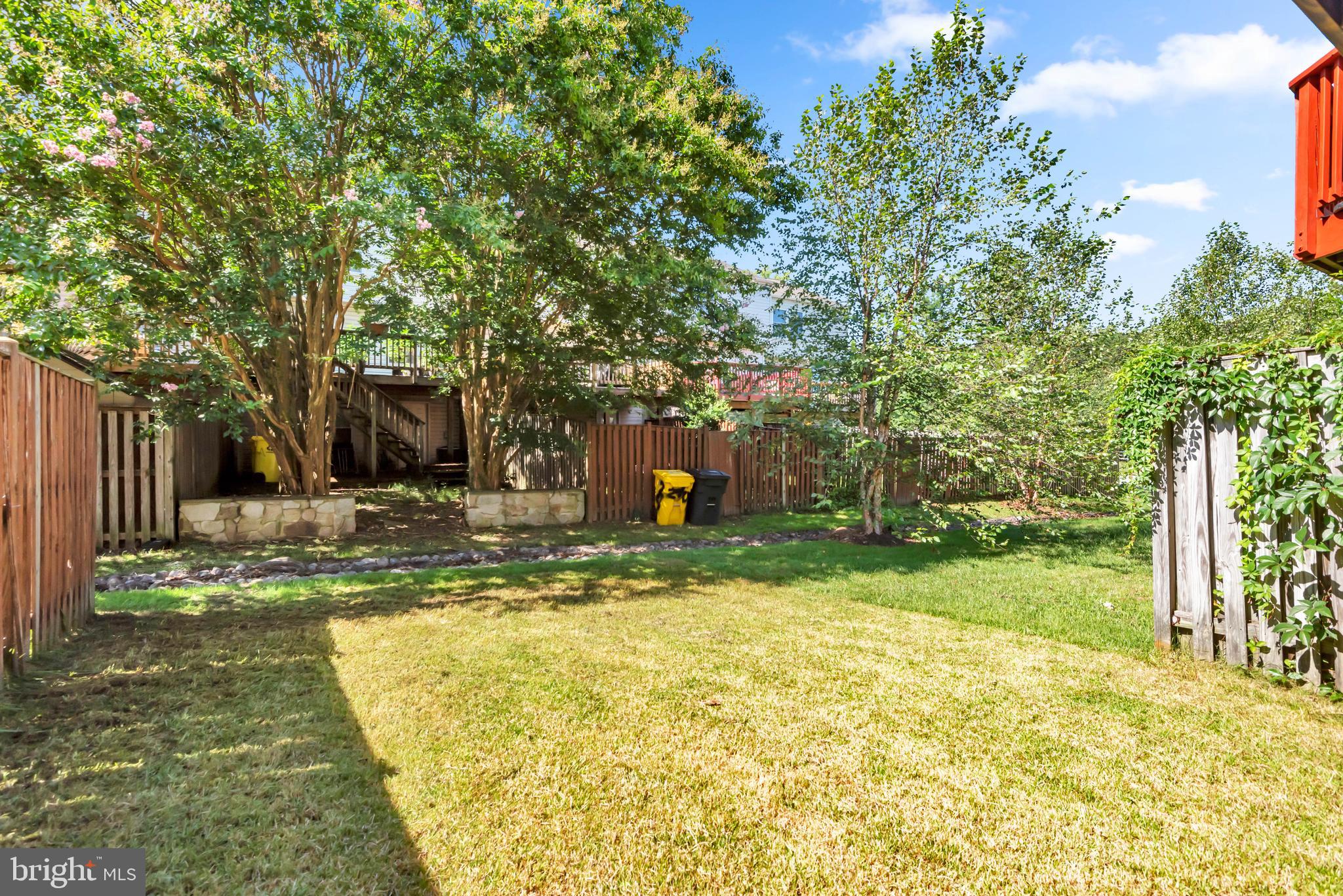 2407 Warm Spring Way Odenton, MD 21113 - Photo 34 of 45 a view of a yard with plants and large trees