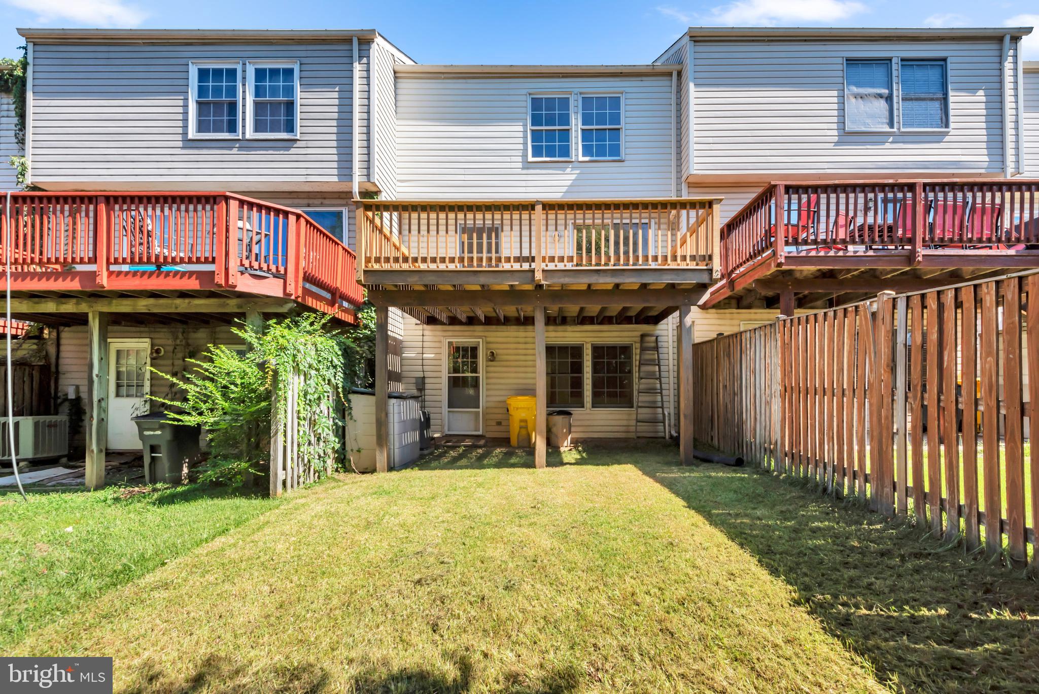 2407 Warm Spring Way Odenton, MD 21113 - Photo 35 of 45 a front view of a house with a garden and plants
