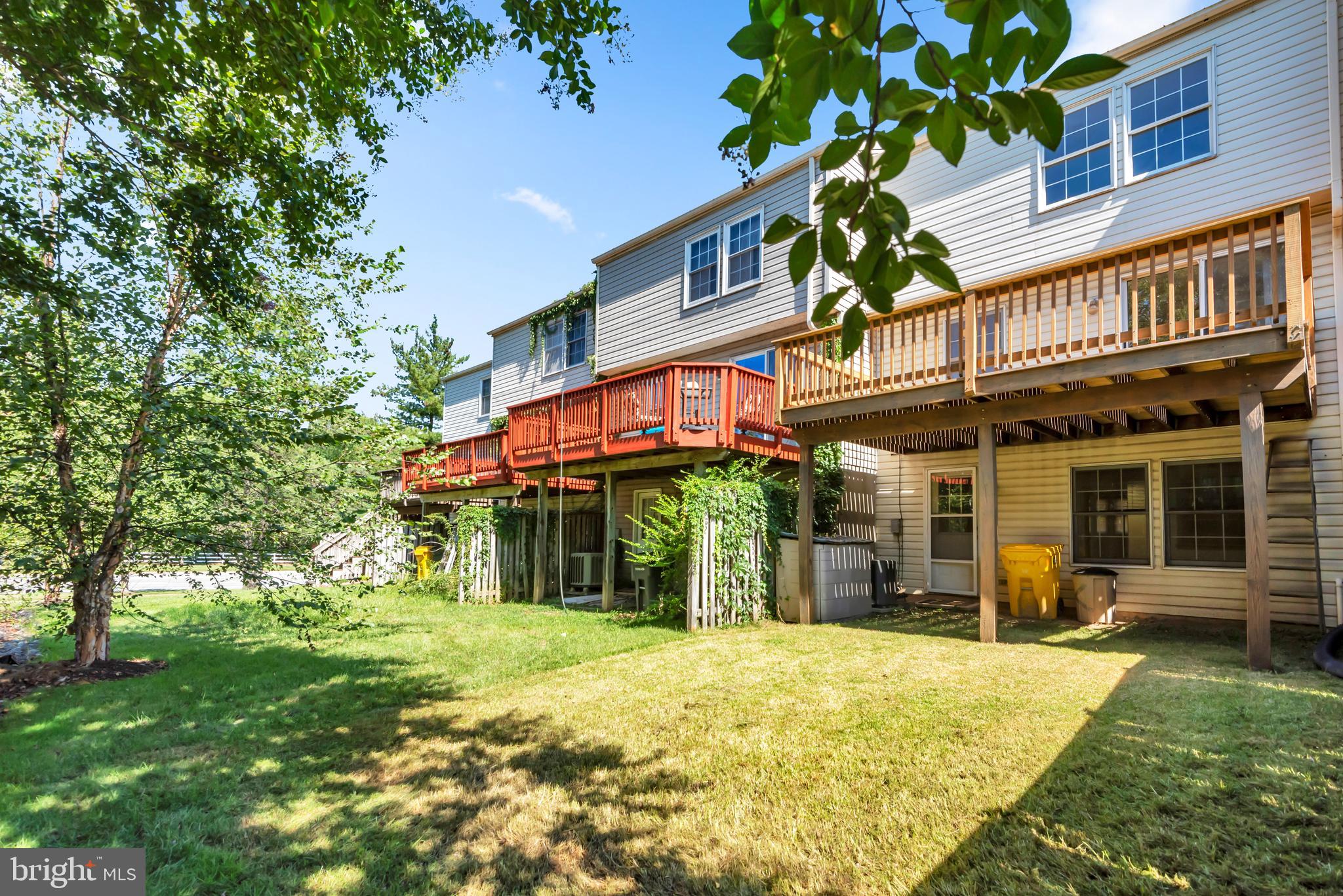 2407 Warm Spring Way Odenton, MD 21113 - Photo 37 of 45 front view of a building with a yard