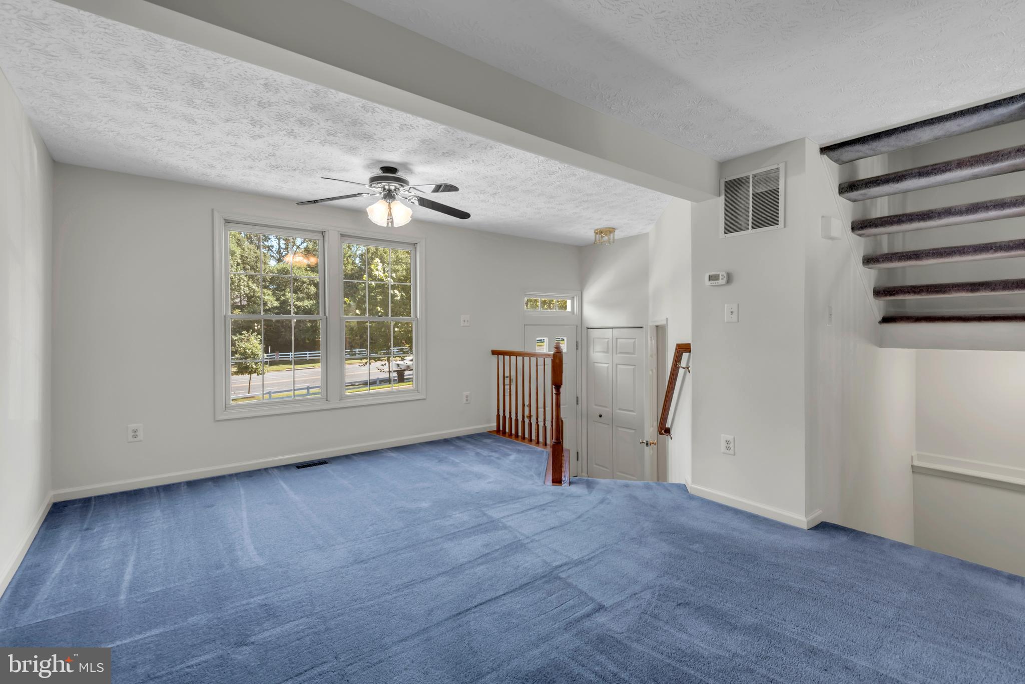 2407 Warm Spring Way Odenton, MD 21113 - Photo 4 of 45 wooden floor in an empty room with a window