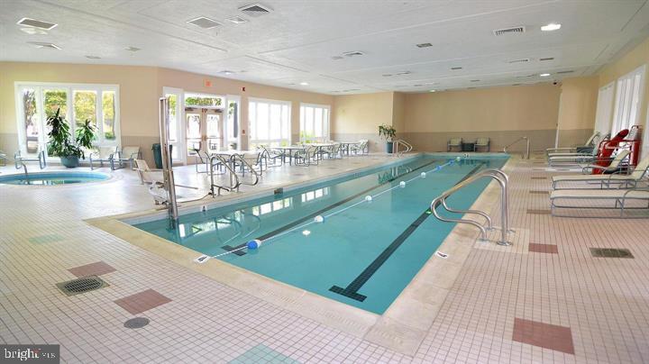 2407 Warm Spring Way Odenton, MD 21113 - Photo 42 of 45 a large swimming pool with chairs