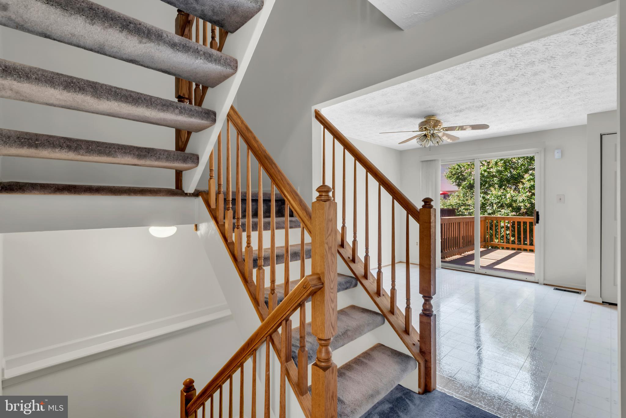 2407 Warm Spring Way Odenton, MD 21113 - Photo 6 of 45 a view of staircase with lots of frames on wall and a window