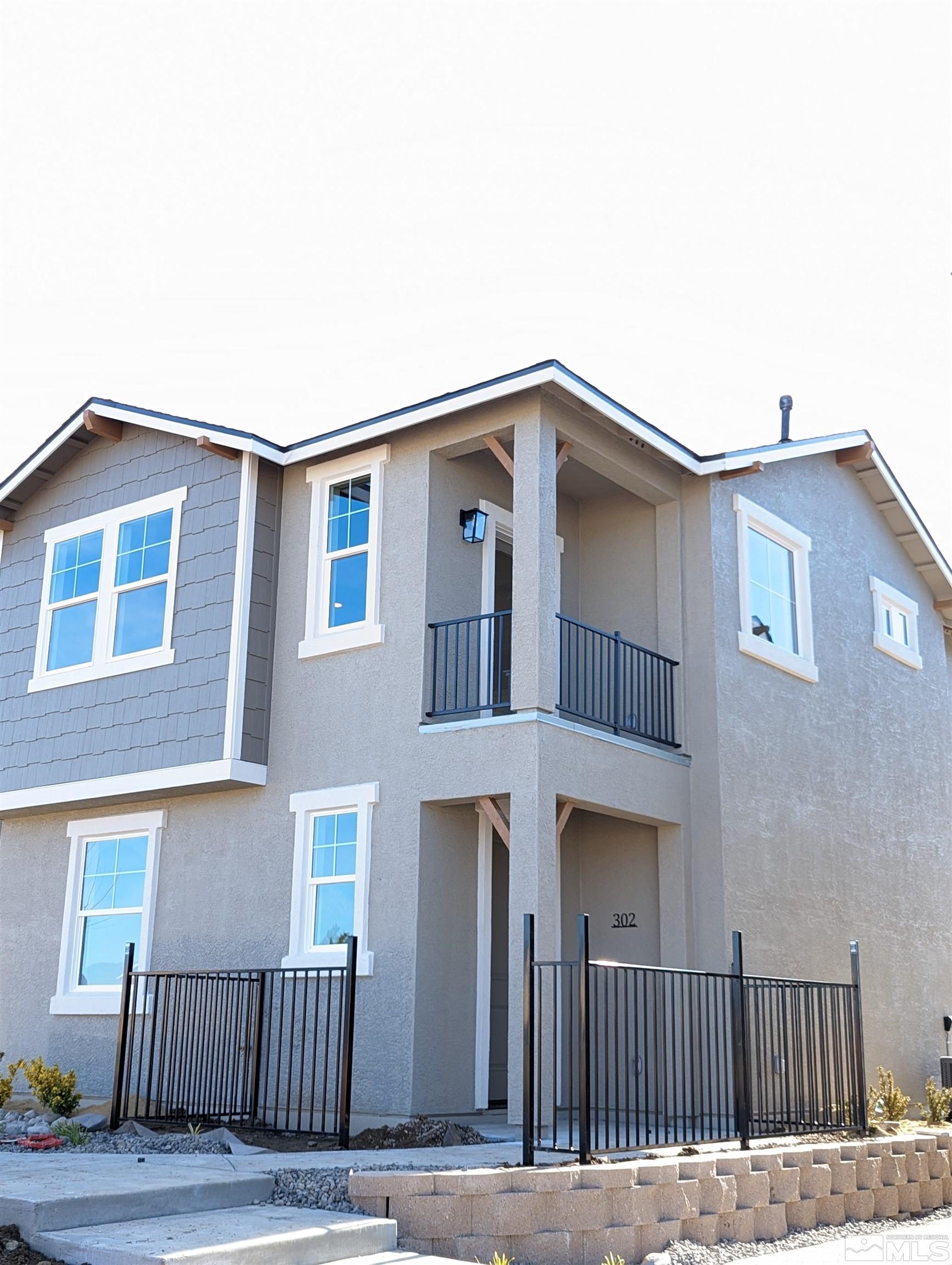 a front view of a house with stairs