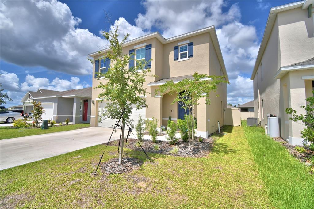 2839 Moulin Road Davenport, FL 33837 - Photo 4 of 75 a view of a house with a fountain in a yard