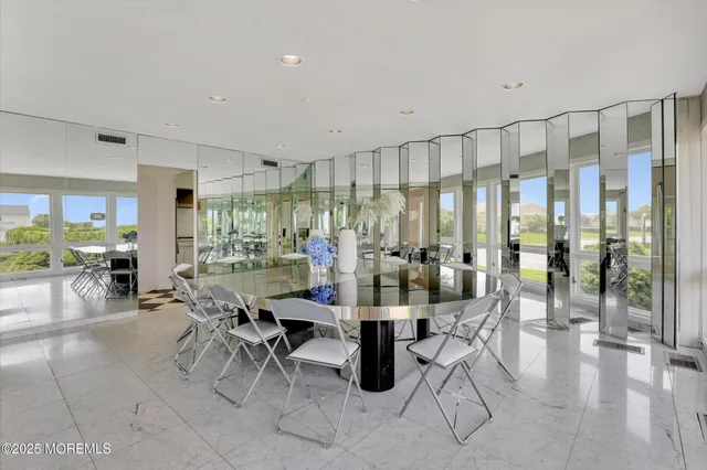 a bathroom with a bathtub shower sink and mirror