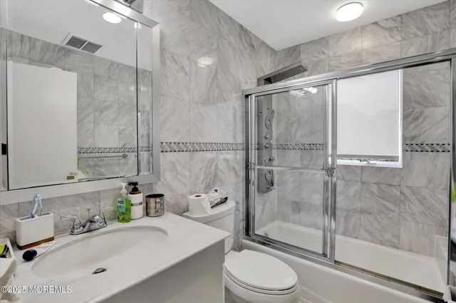 a room with a bed and a mirror