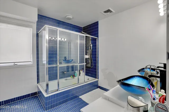 a view of a patio with couches and table and chairs and potted plants