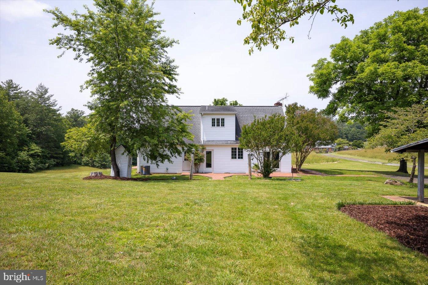 274 Aaron Mountain Road Castleton, VA 22716 - Photo 38 of 76 Back of home nestled in lush greenery.
