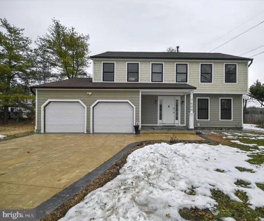 a view of a house with snow on the road