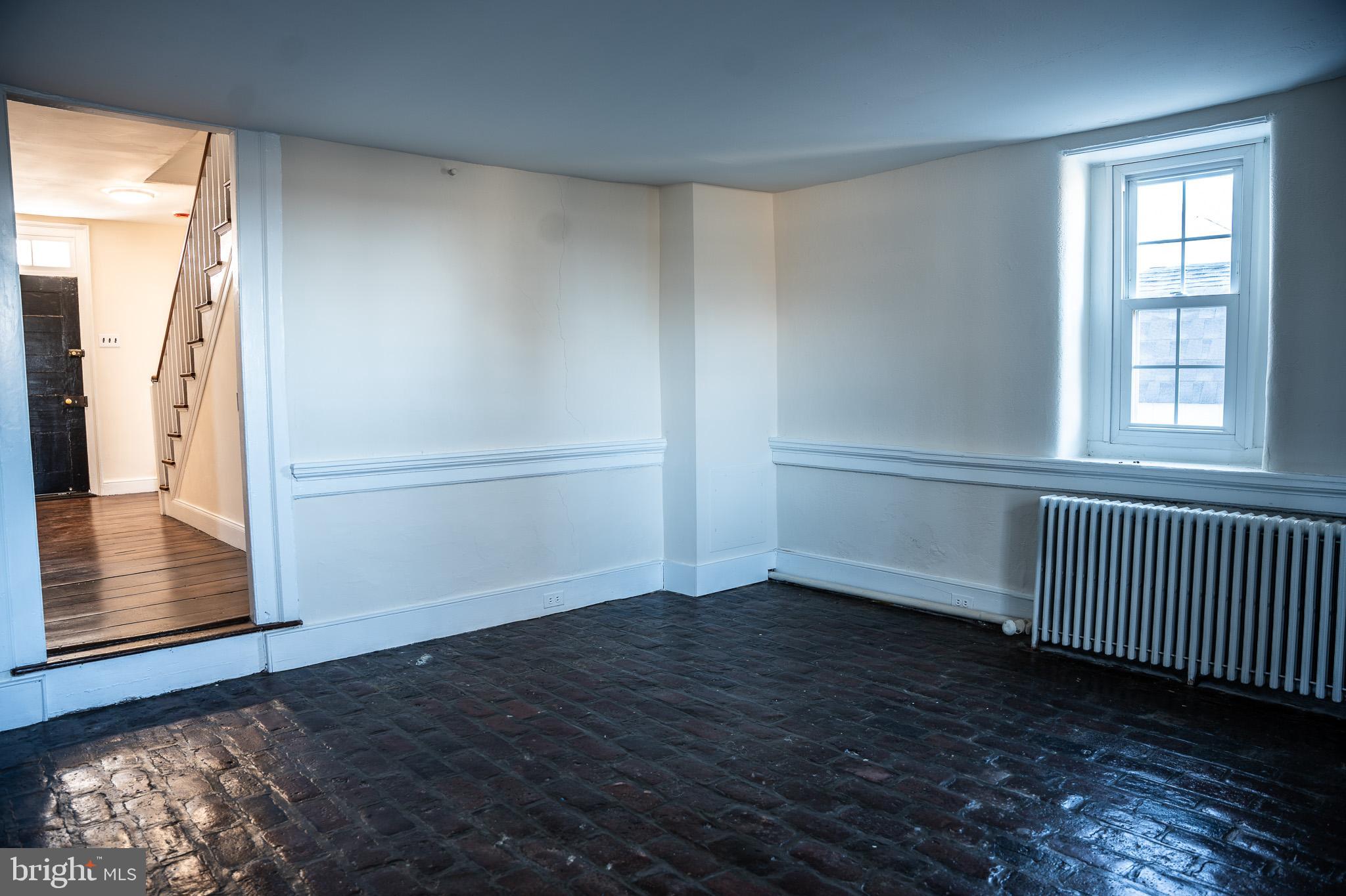395 Bishop Hollow Road, Unit C Newtown Square, PA 19073 - Photo 13 of 28 an empty room with wooden floor and windows