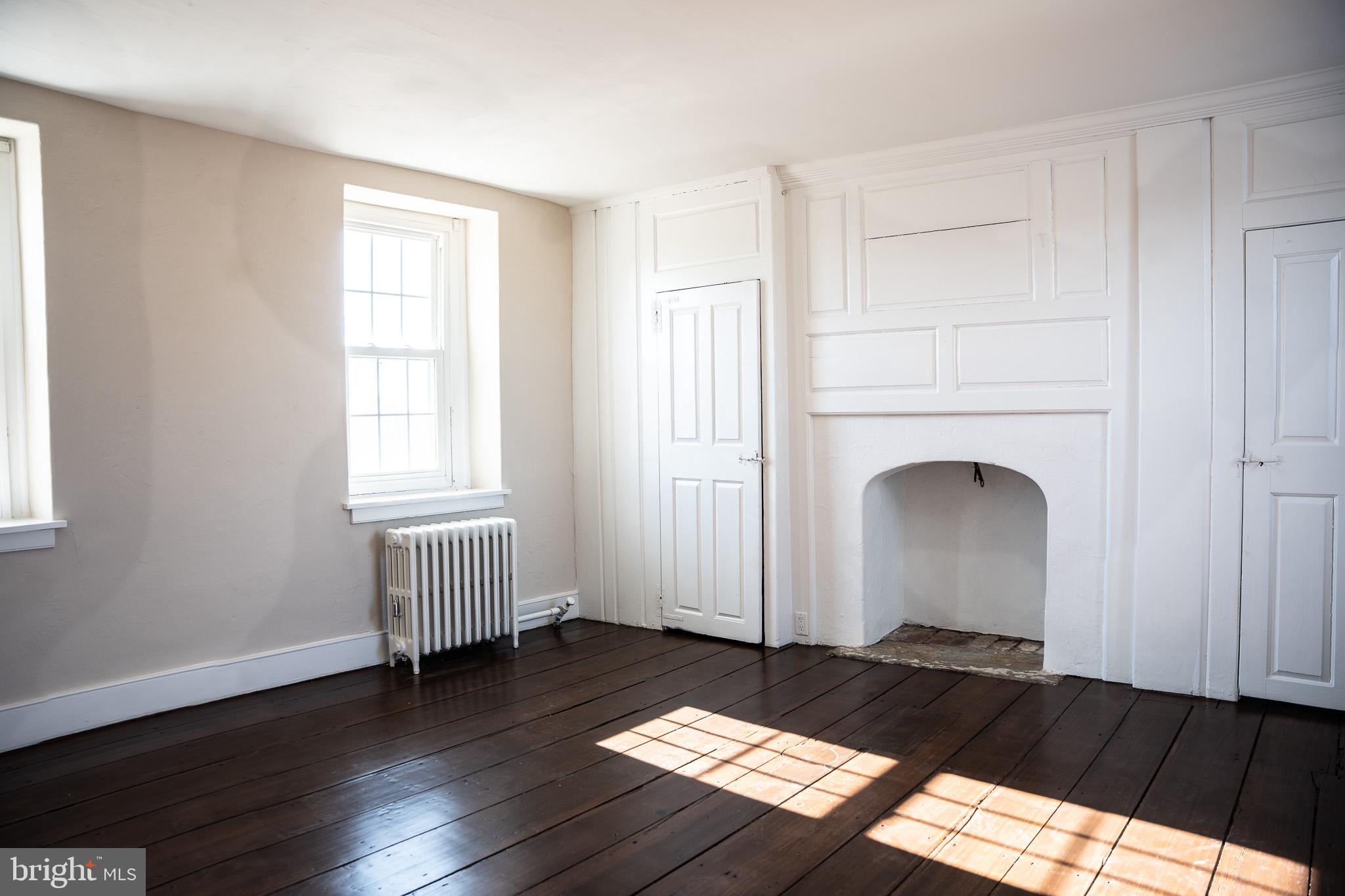 395 Bishop Hollow Road, Unit C Newtown Square, PA 19073 - Photo 19 of 28 a view of a livingroom with wooden floor
