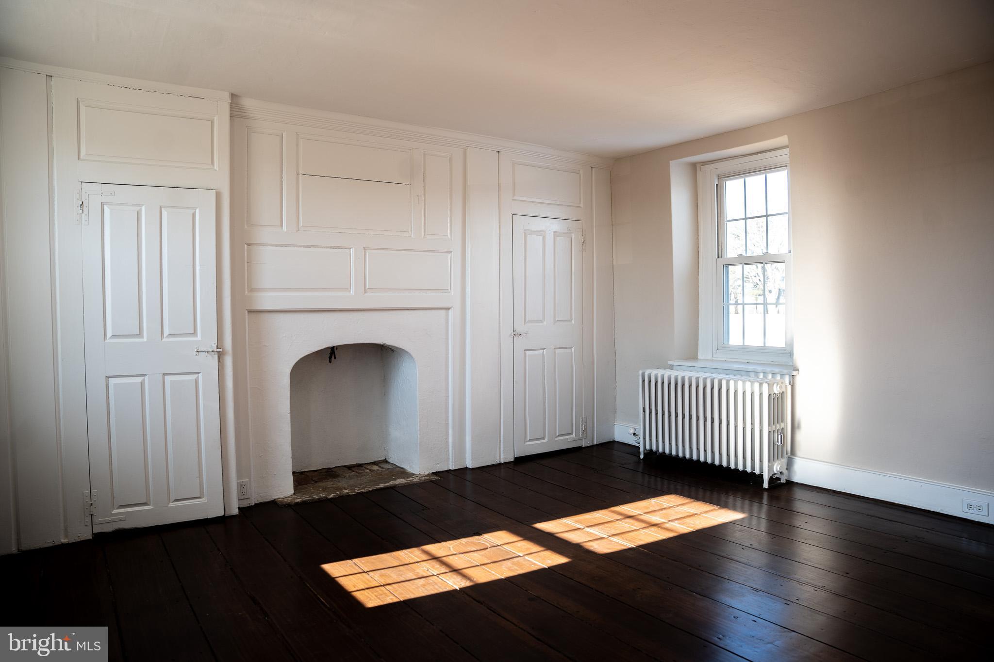 395 Bishop Hollow Road, Unit C Newtown Square, PA 19073 - Photo 20 of 28 a view of a room with wooden floor and windows