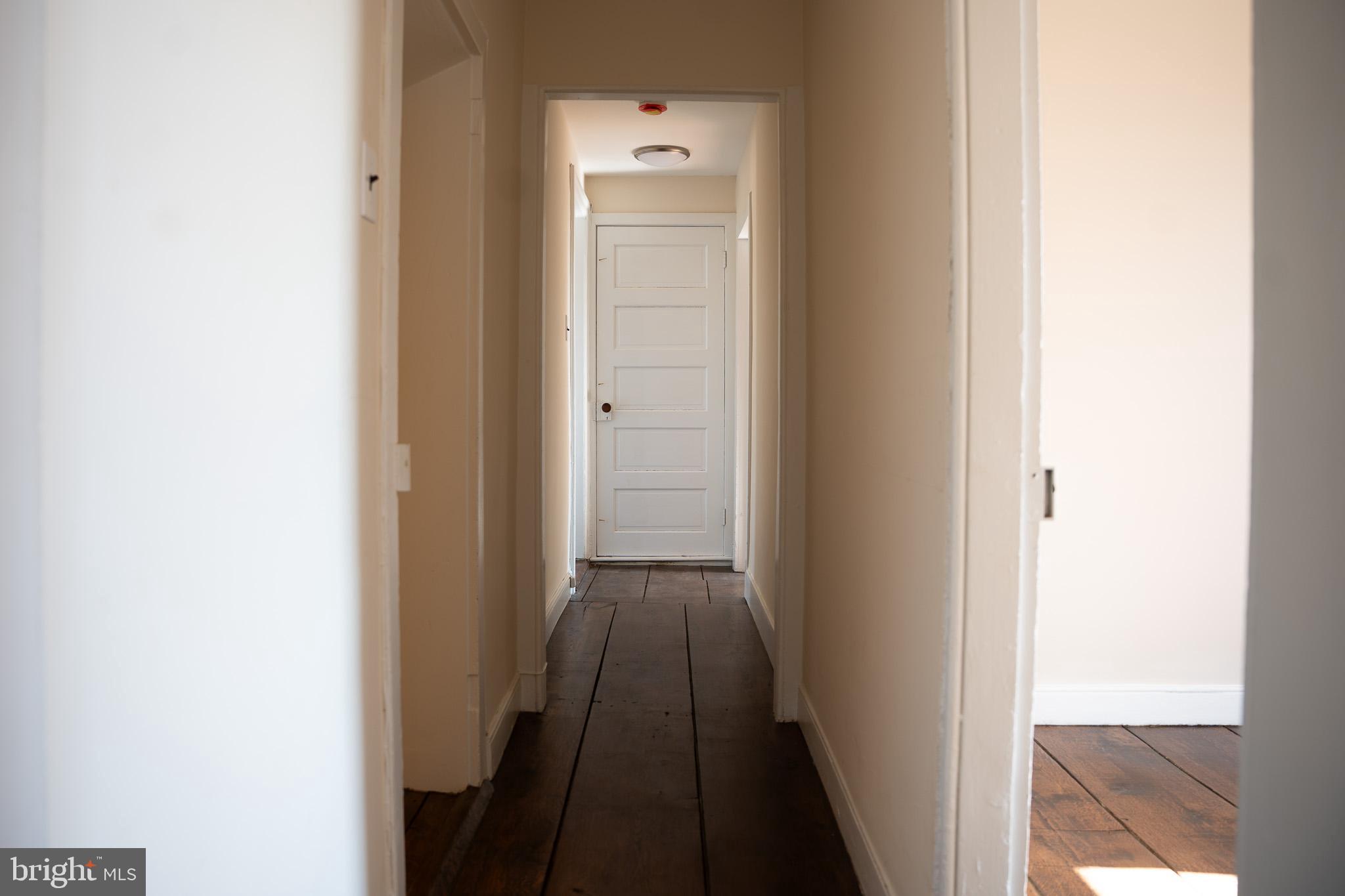 395 Bishop Hollow Road, Unit C Newtown Square, PA 19073 - Photo 21 of 28 a view of a hallway with wooden floor