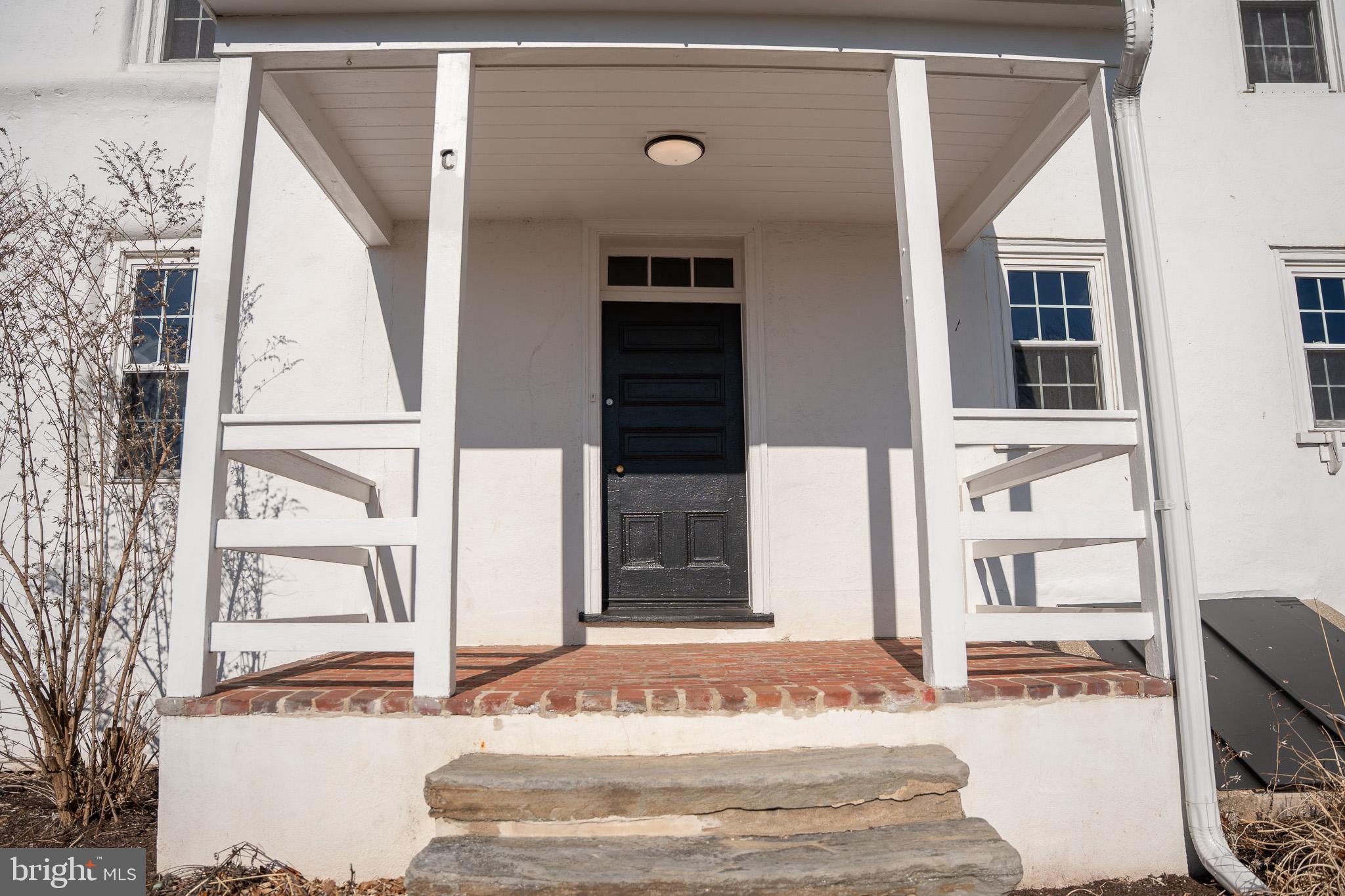 395 Bishop Hollow Road, Unit C Newtown Square, PA 19073 - Photo 4 of 28 a front view of a house with a window