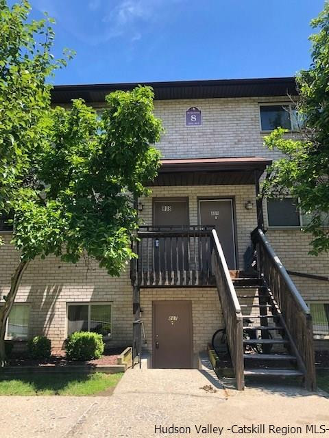 26 Cooper Road, Unit 807 Poughkeepsie, NY 12603 - Photo 1 of 4 a front view of a house with garden