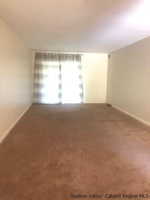 26 Cooper Road, Unit 807 Poughkeepsie, NY 12603 - Photo 3 of 4 a view of an empty room with a window