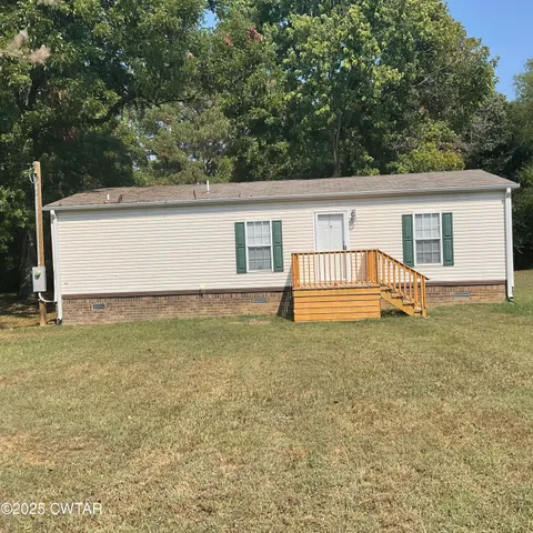 a house with garden in front of it
