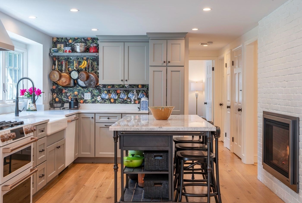3 Jeffrey's Neck Road Ipswich, MA 01938 - Photo 14 of 42 a kitchen with stainless steel appliances a stove refrigerator and cabinets