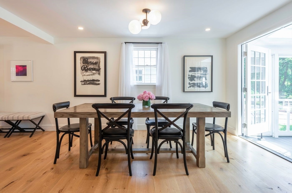 3 Jeffrey's Neck Road Ipswich, MA 01938 - Photo 16 of 42 a view of a dining room with furniture window and wooden floor