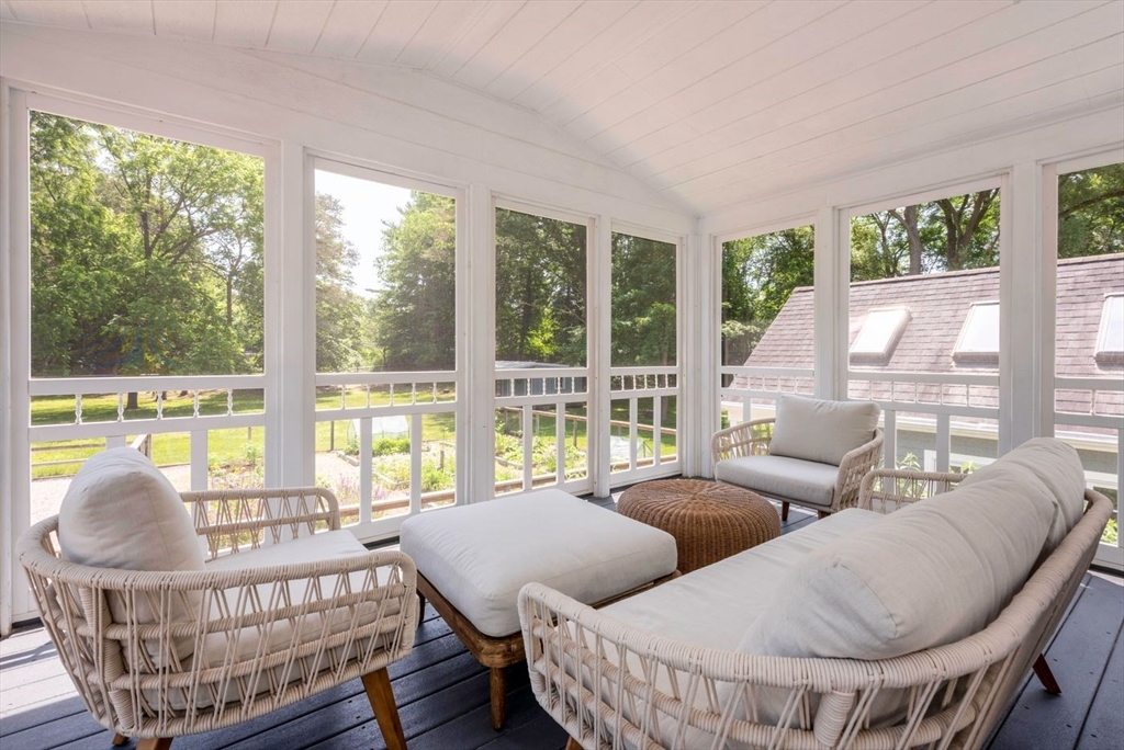 3 Jeffrey's Neck Road Ipswich, MA 01938 - Photo 18 of 42 a living room with furniture and a large window