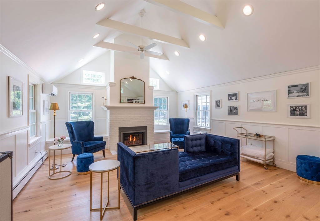 3 Jeffrey's Neck Road Ipswich, MA 01938 - Photo 19 of 42 a living room with furniture and a fireplace