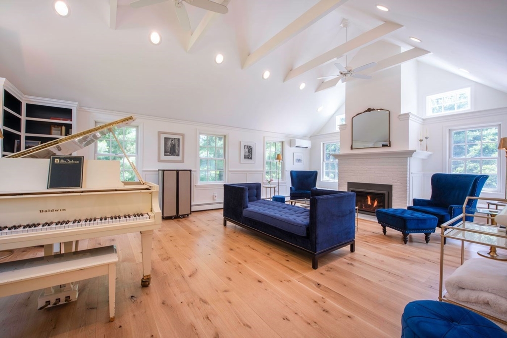 3 Jeffrey's Neck Road Ipswich, MA 01938 - Photo 20 of 42 a living room with furniture and a fireplace