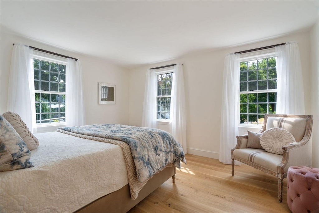 3 Jeffrey's Neck Road Ipswich, MA 01938 - Photo 22 of 42 a bedroom with a bed couch and window