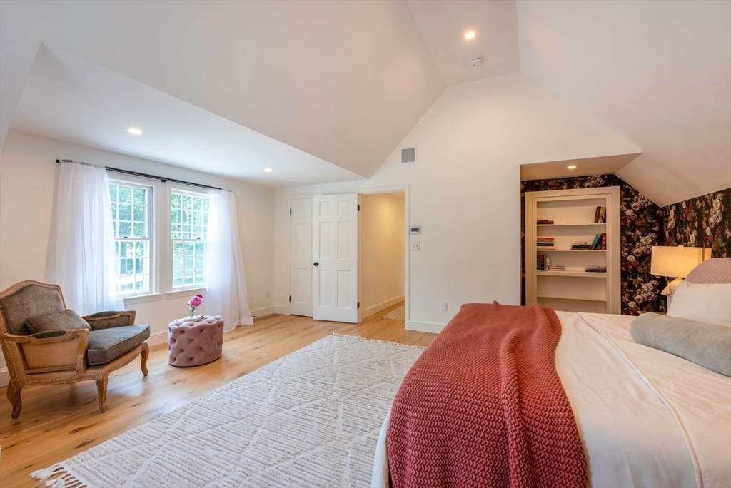 3 Jeffrey's Neck Road Ipswich, MA 01938 - Photo 26 of 42 a bedroom with a bed and furniture