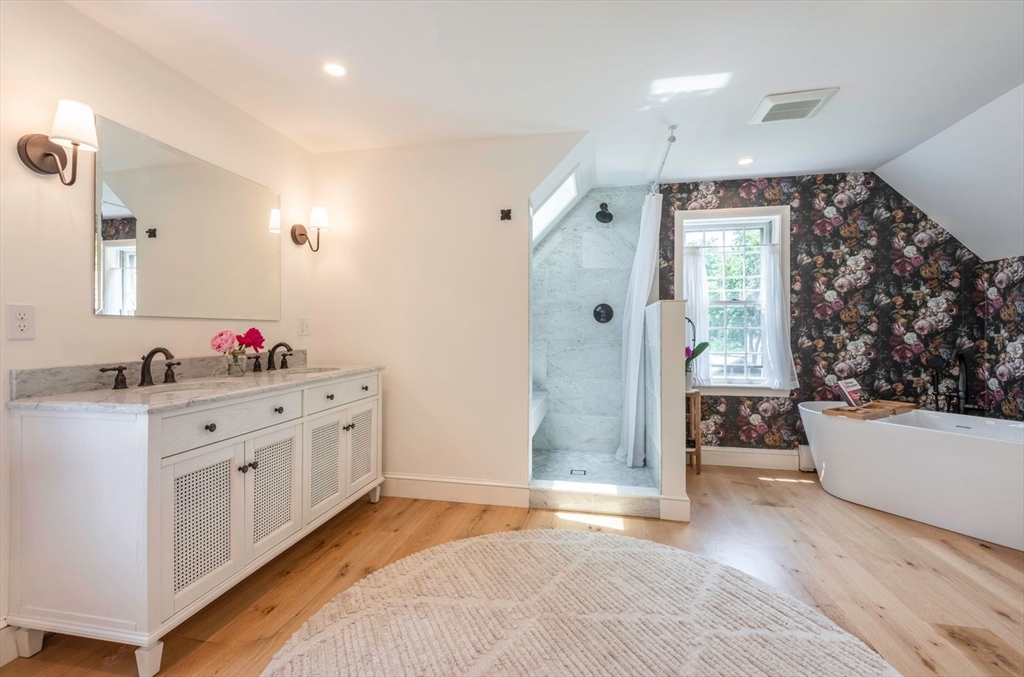 3 Jeffrey's Neck Road Ipswich, MA 01938 - Photo 27 of 42 a spacious bathroom with a granite countertop tub sink and mirror
