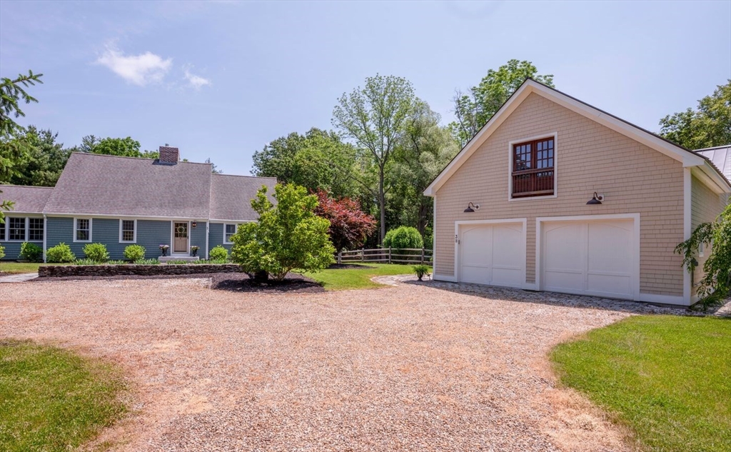 3 Jeffrey's Neck Road Ipswich, MA 01938 - Photo 34 of 42 a view of a house with a yard and potted plants