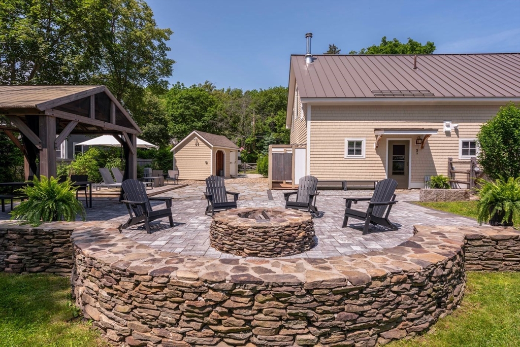 3 Jeffrey's Neck Road Ipswich, MA 01938 - Photo 36 of 42 a view of house with backyard outdoor seating and green space