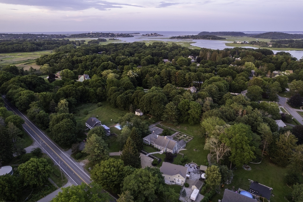 3 Jeffrey's Neck Road Ipswich, MA 01938 - Photo 4 of 42 an aerial view of a houses with a street and trees