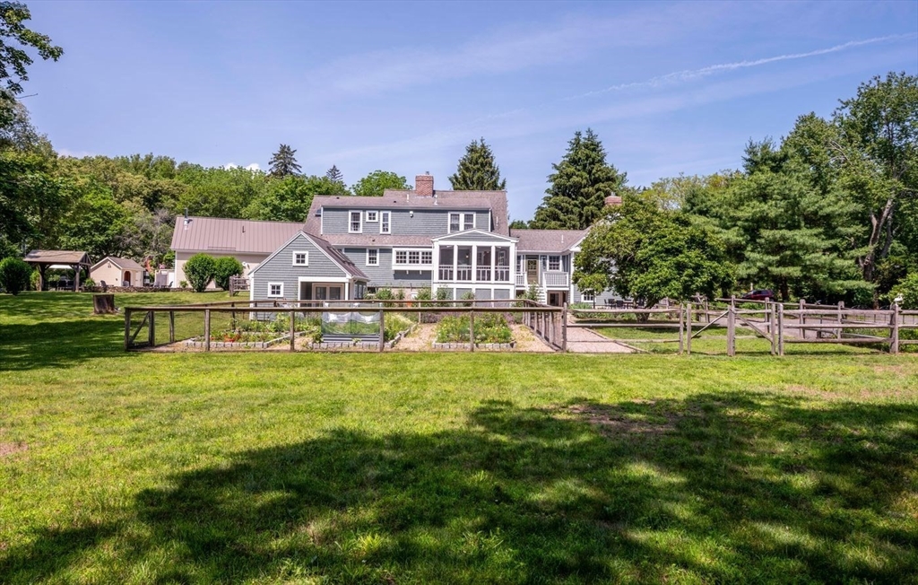 3 Jeffrey's Neck Road Ipswich, MA 01938 - Photo 6 of 42 a view of a house with swimming pool and a yard